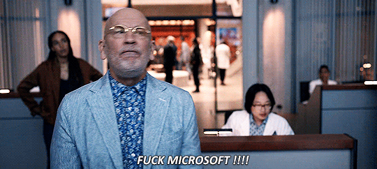 A person yelling 'FUCK MICROSOFT' with extreme rage